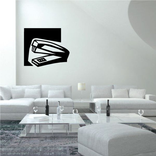 Stapler wall decal with black square background and white stapler icon