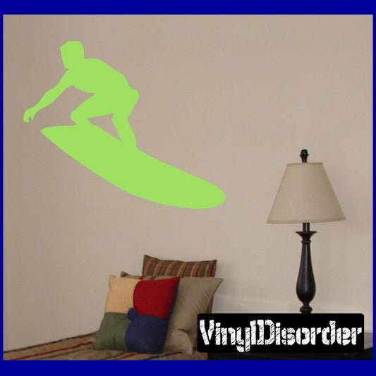Surfing wall decal: green surfer silhouette on surfboard