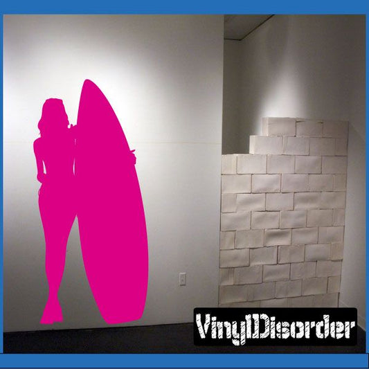 Surfing wall decal of pink surfer silhouette with surfboard