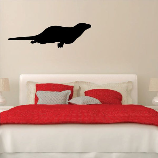 Swimming otter decal, black silhouette with raised flipper and tail