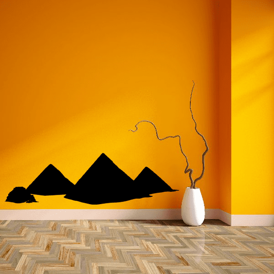 Wall decal showing dark pyramid silhouettes with a winding line and desert scene