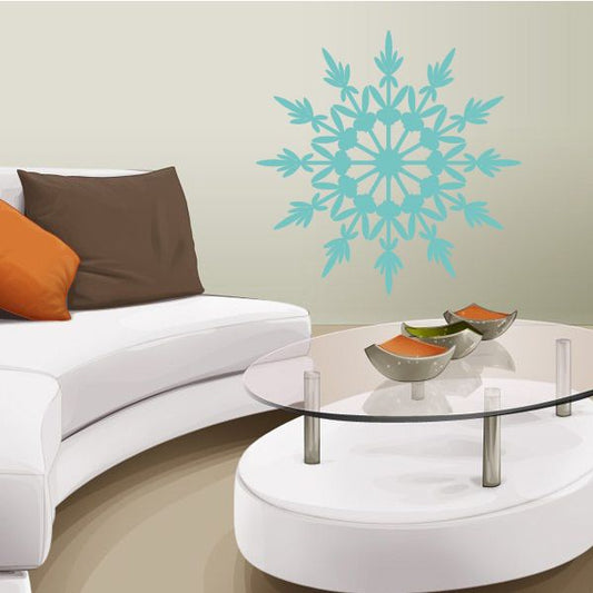 Twelve-pointed snowflake decal, teal intricate starburst on wall