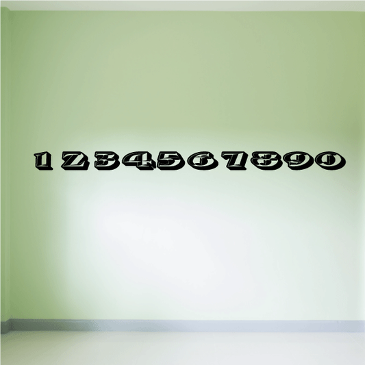 Various sizes of race number stickers displayed on a surface