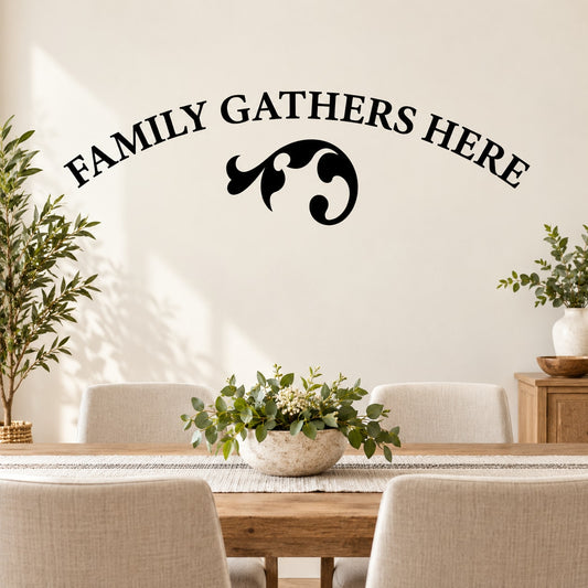 Black wall quote decal with 'FAMILY GATHERS HERE' text and decorative swirl