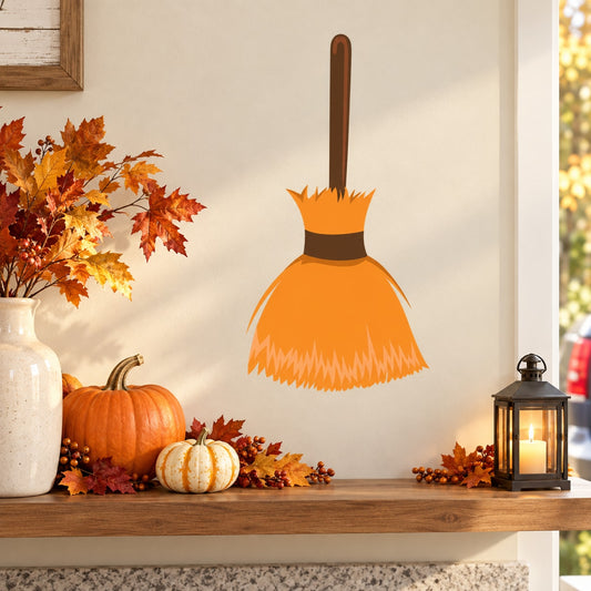 Halloween witch broom sticker with orange bristles and black handle and band