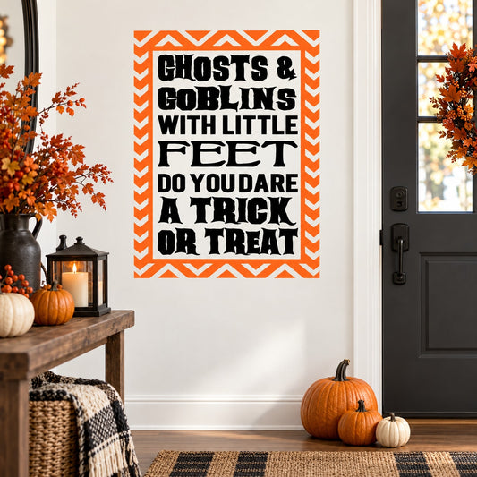 Halloween wall decal with orange chevron border and black quote text: 'Ghosts & Goblins'