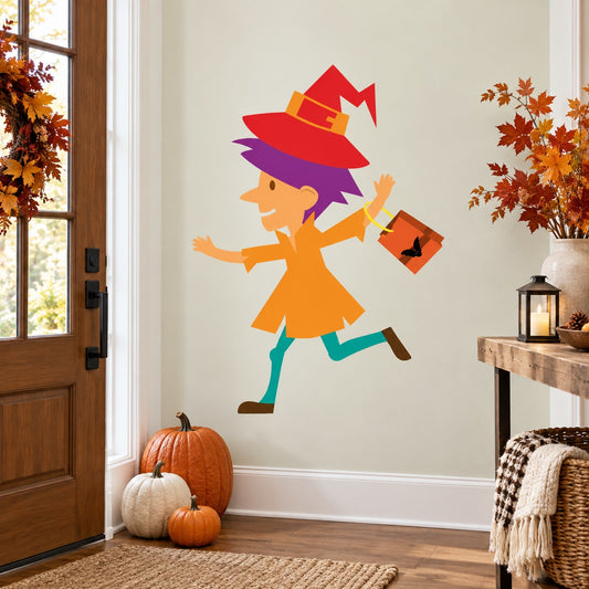 Halloween witch trick-or-treating sticker: cartoon girl in red hat holding candy bag.