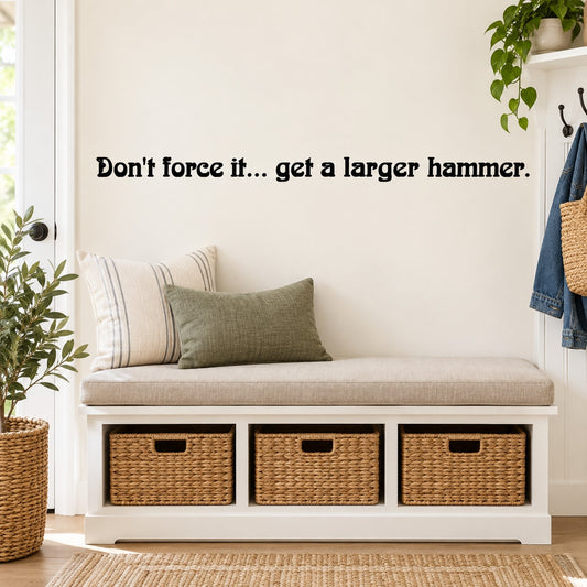 Wall decal text: "Don't force it... get a larger hammer".