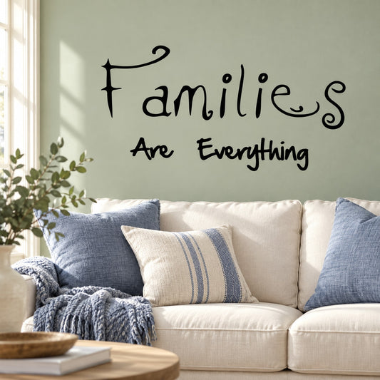 Black wall quote decal: 'families are everything' in cursive with smile