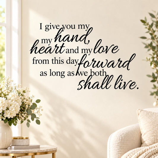 Hand heart love quote decal, cursive lettering in dark text on wall