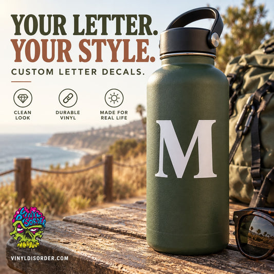 White letter 'M' vinyl decal on olive green bottle