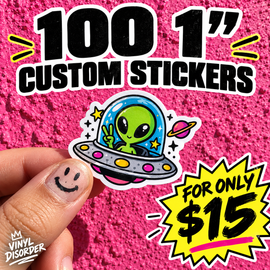 Hand holding custom vinyl sticker: blue alien with UFO, neon yellow $15 badge