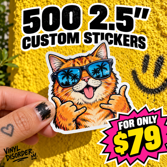 Orange cat vinyl sticker with blue sunglasses, held by fingers
