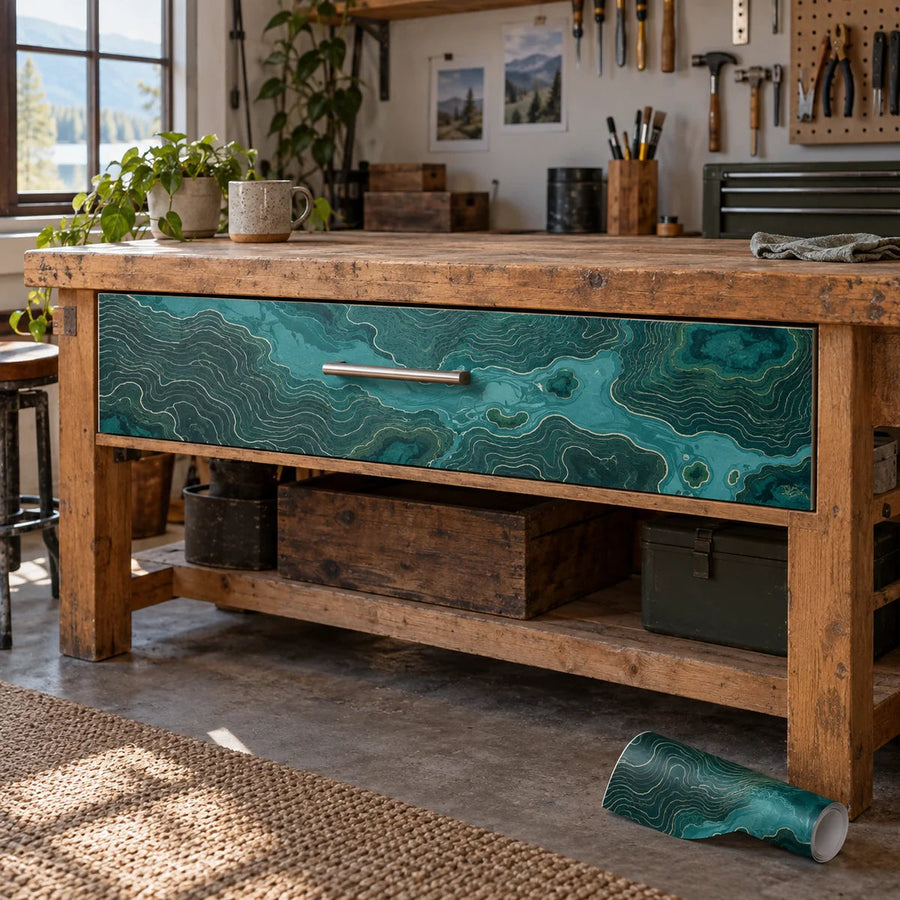 Workbench drawer panel vinyl wrap with turquoise topographic pattern on drawer front