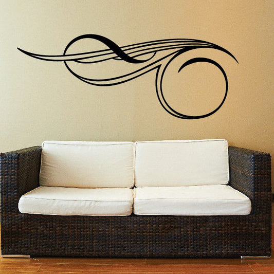 Black pinstripe vinyl decal with swirling lines and circular emblem