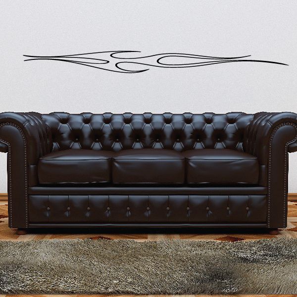 Black pinstripe vinyl decal with flame-style swirl lines across a wall