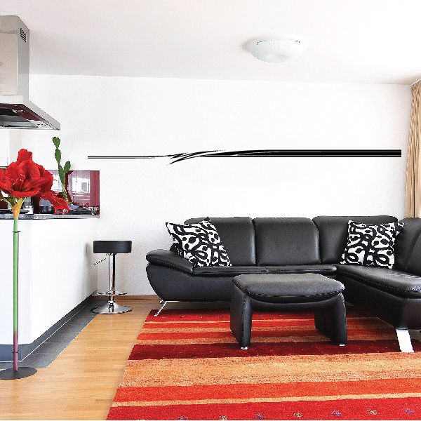 Vehicle pinstripe vinyl decal with thin black horizontal stripes on wall.