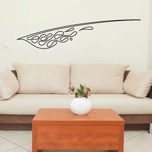 Vehicle pinstripe vinyl decal with black flame scroll design on a wall