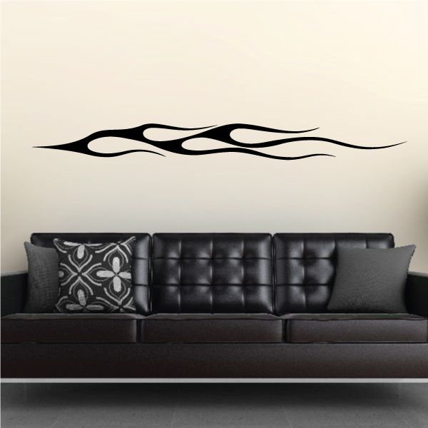 Vehicle pinstripe vinyl decal, black flame stripe design on a wall