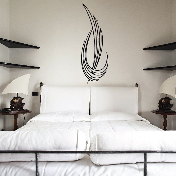 Pinstripe vinyl decal with black swirl feather pattern on a wall