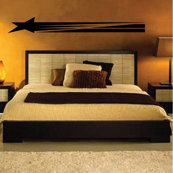 Black pinstripe arrow vinyl decal with long horizontal stripes on wall
