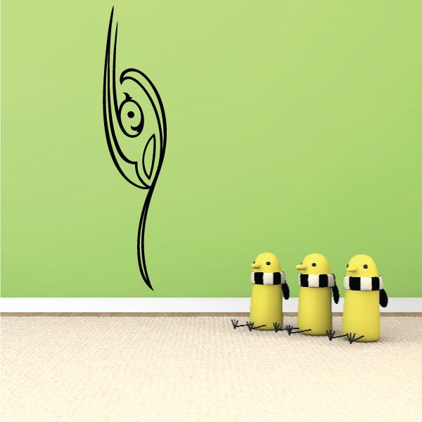 Vinyl pinstripe decal with black swirl graphic on green surface