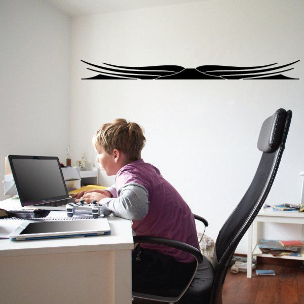 Black pinstripe vinyl decal with swooping double-line graphic on a flat surface