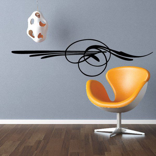 Pinstripe vinyl vehicle decal with black swirl lines and orange shield shape