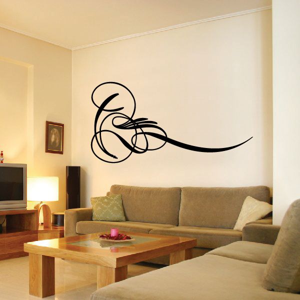 Black pinstripe vinyl swirl decal on a wall, curved scroll design