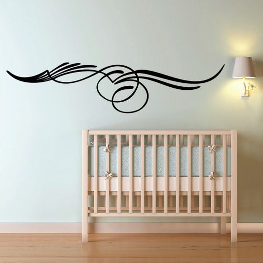 Black pinstripe vinyl decal with swooping lines and circular motifs on light wall