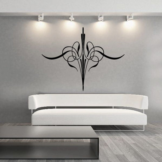 Black ornate pinstripe vinyl decal with stylized scrolls and central spear shape