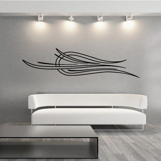 Vehicle pinstripe vinyl decal with black sweeping stripe lines on wall