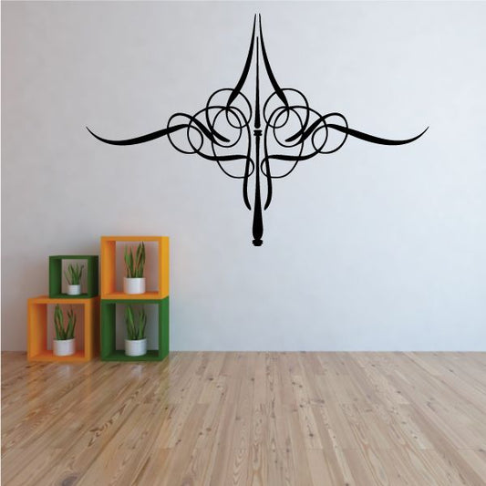 Black pinstripe vinyl decal with ornate scrollwork and central spear tip