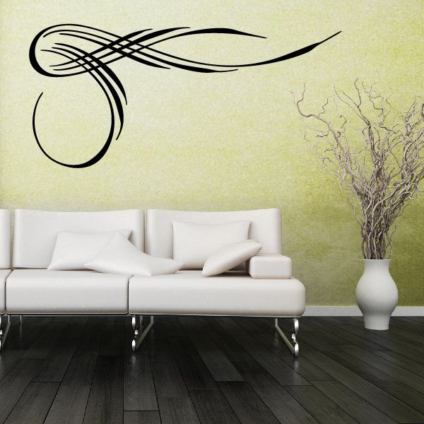 Black vehicle pinstripe vinyl decal with sweeping flame swirl design on wall