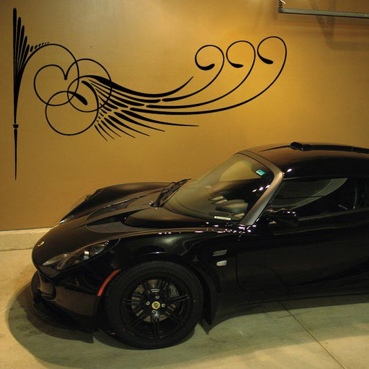 Black vinyl pinstripe decal with ornate swirl lines for vehicle or wall