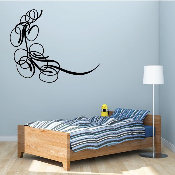 Black vinyl wall scroll decal with curled vine and loops