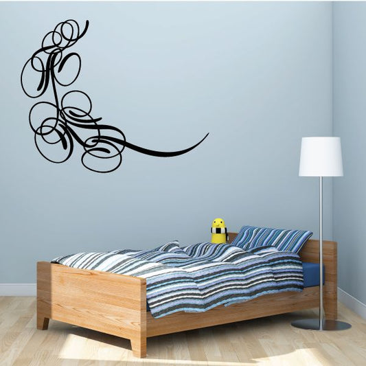 Black vinyl wall scroll decal with curled vine and loops