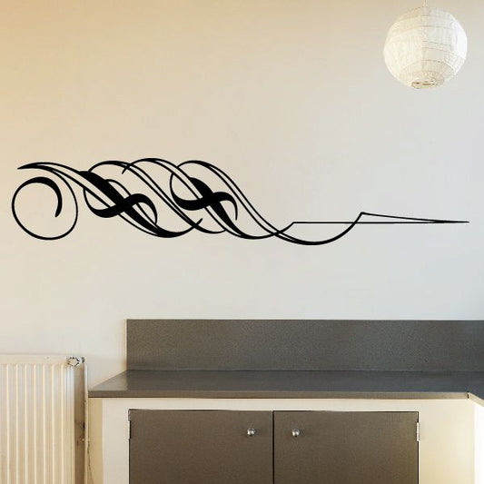 Black vehicle pinstripe vinyl decal with curving ornamental scroll lines