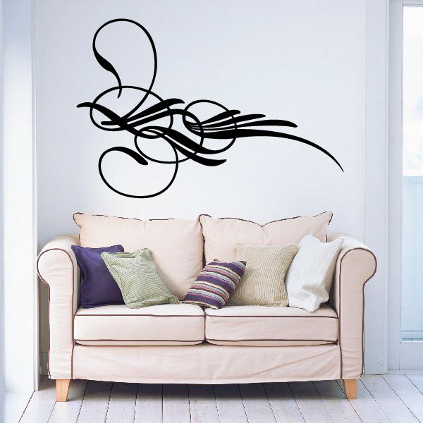 Vehicle pinstripe vinyl decal with black swirling pinstripe lines on a wall