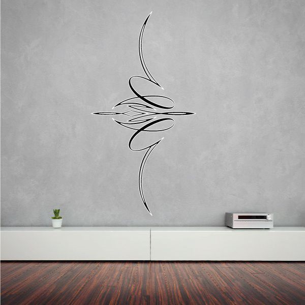 Black vehicle pinstripe vinyl decal with swooping tribal-style lines on wall