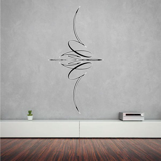 Black vehicle pinstripe vinyl decal with swooping tribal-style lines on wall