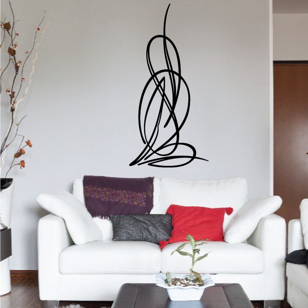 Black cursive pinstripe vinyl decal on wall above couch