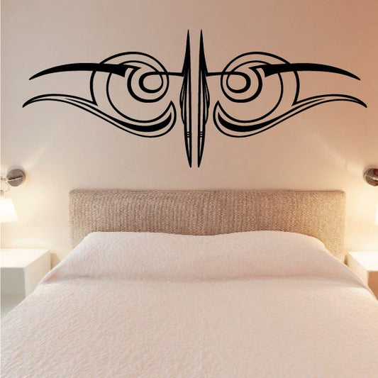 Black vehicle pinstripe vinyl decal with tribal wing design for wall