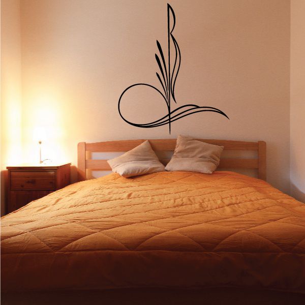 Pinstripe vinyl decal with dark swirling feather-like ornament on wall