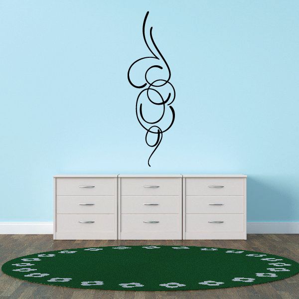 Green pinstripe vinyl decal with swirl pattern, circular design on floor