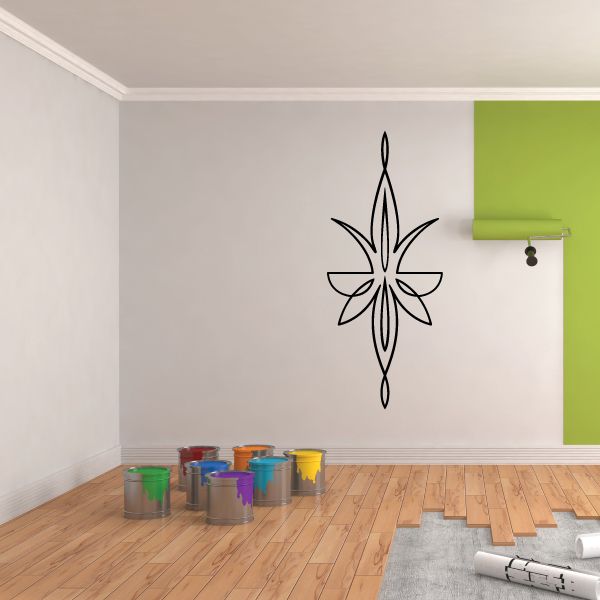 Black pinstripe vinyl decal with starburst cross design on a wall