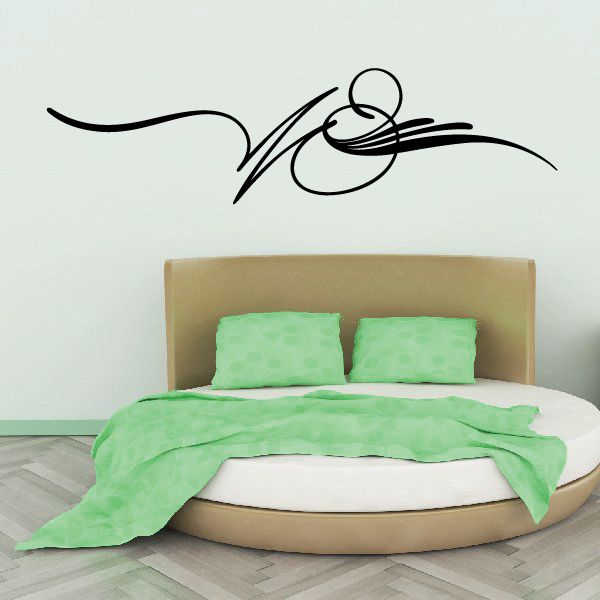 Black vehicle pinstripe vinyl decal with swooping flame-like lines on wall