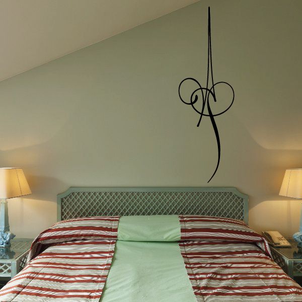 Black vinyl decorative decal with thin curving lines on the wall