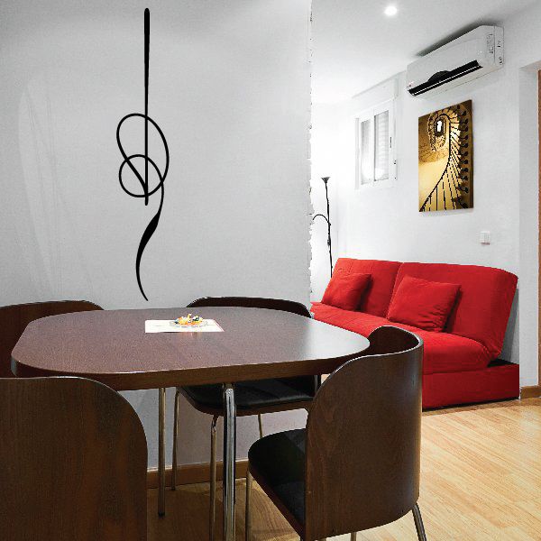 Black pinstripe vinyl decal with looping swirl line on wall surface