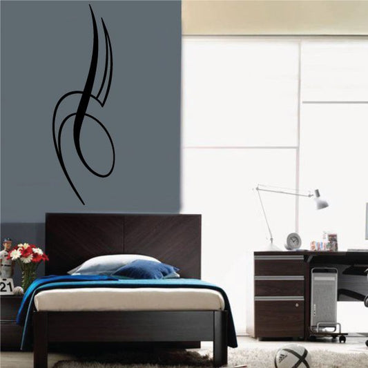 Black pinstripe vinyl decal with curved tribal-style line on wall